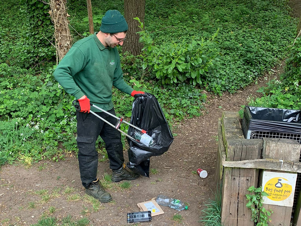 Guy picking up litter